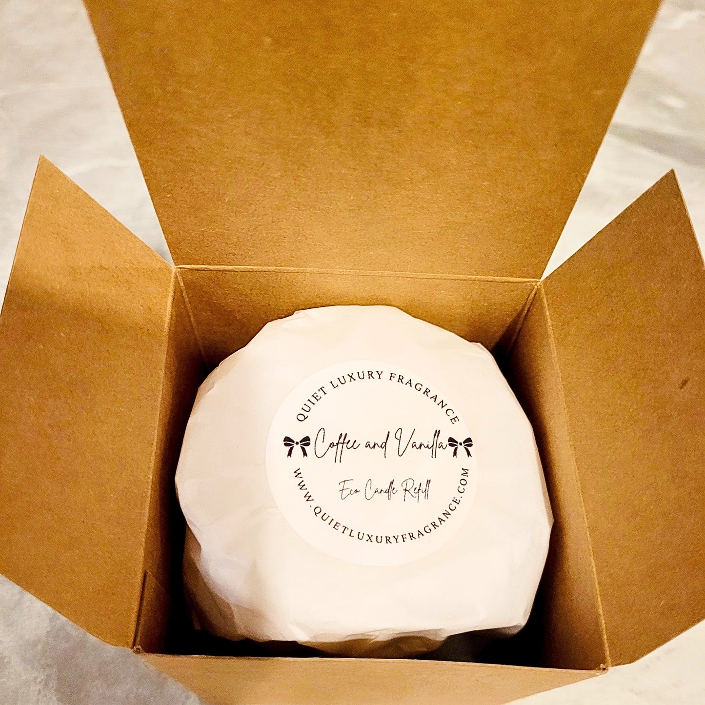 Coffee and vanilla eco candle refill in cardboard box, top view, premium soy wax