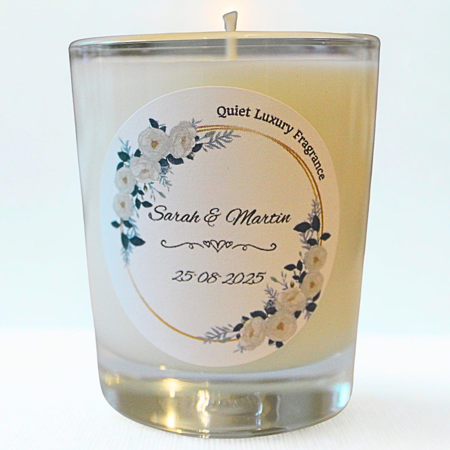 Candle Wedding favour with a personalized label featuring floral design and text on a white background