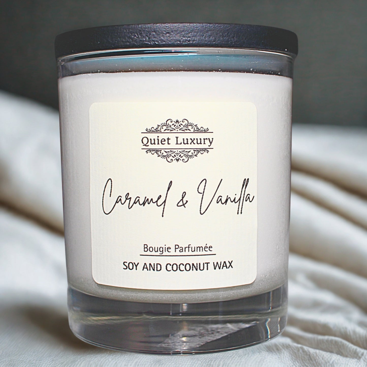 Caramel and vanilla Candle with 'Quiet Luxury' label on a neutral background