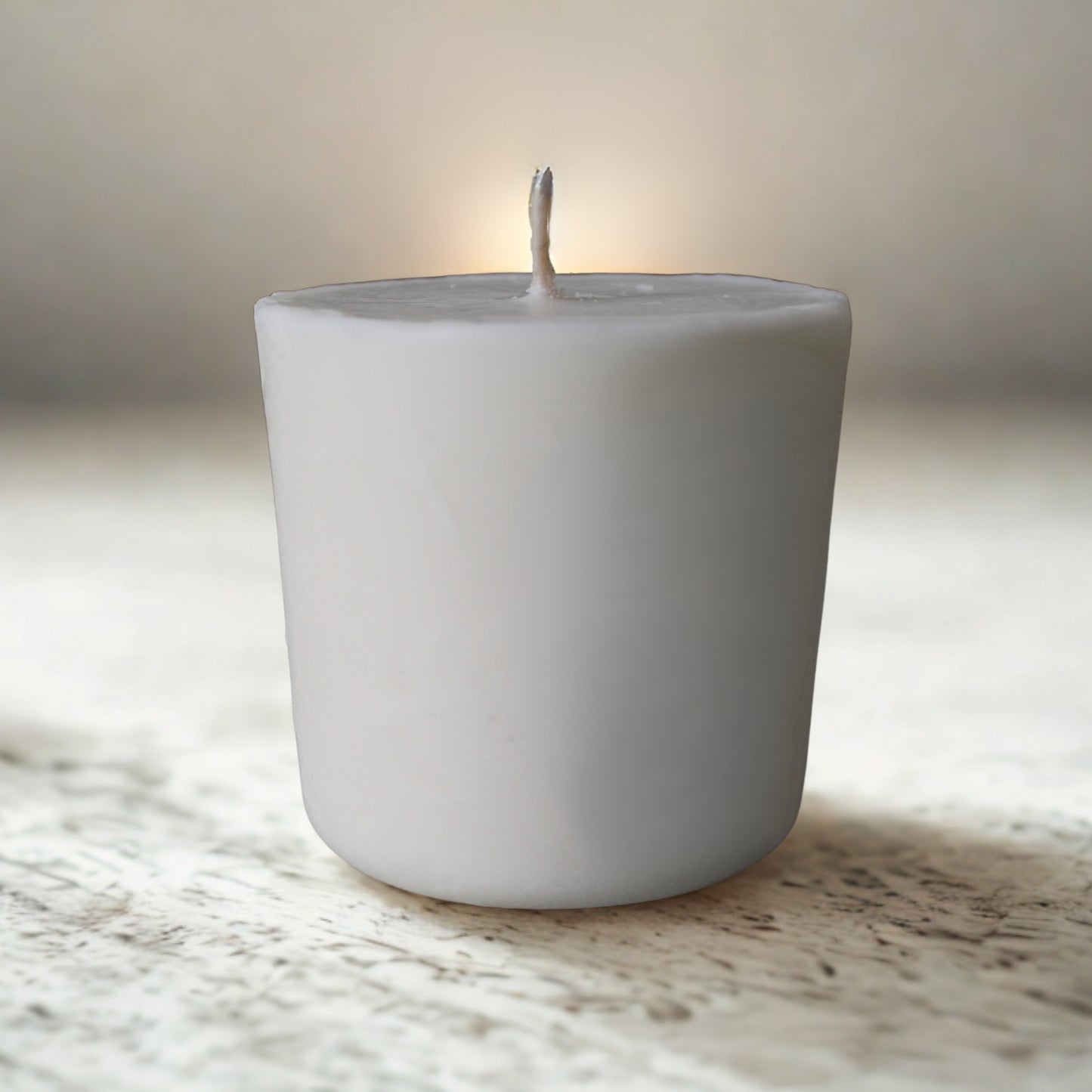 Eco soy candle refill on a marble surface with a blurred background