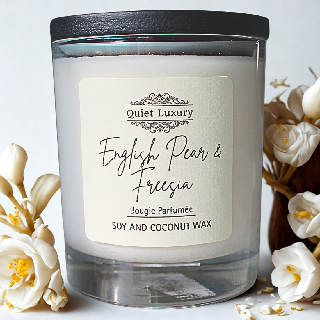 English Pear and Freesia scented candle in glass jar with white flowers, soy and coconut wax