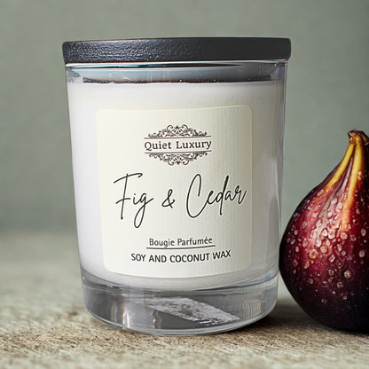 Fig and Cedar scented soy and coconut wax candle with fresh fig on table