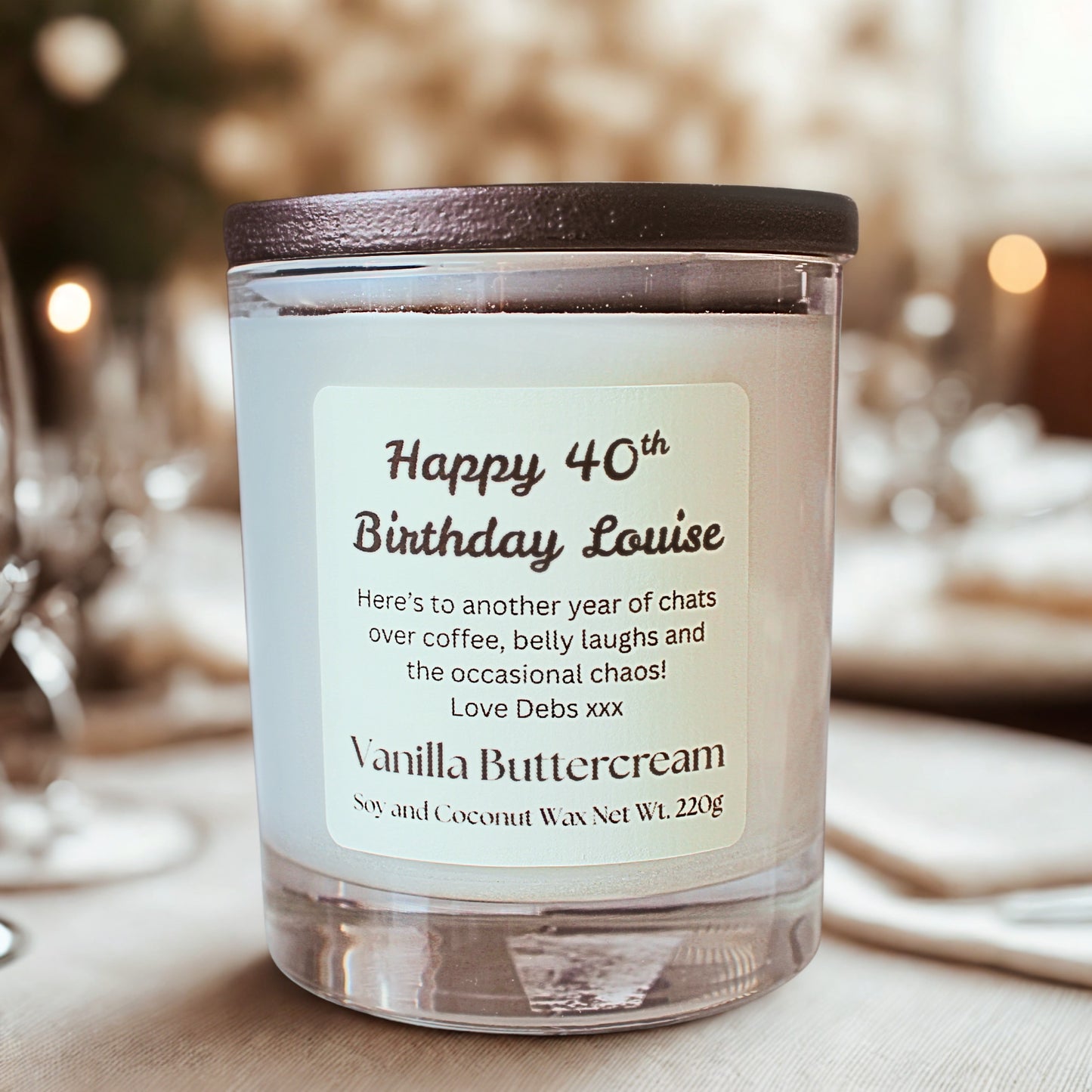 Vanilla Buttercream candle gift with personalized label on a blurred background