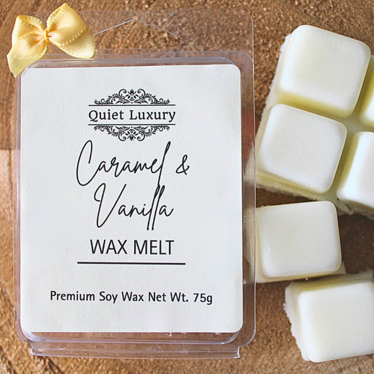 Quiet Luxury Caramel & Vanilla  soy wax melt packaging with wax melts on a wooden surface