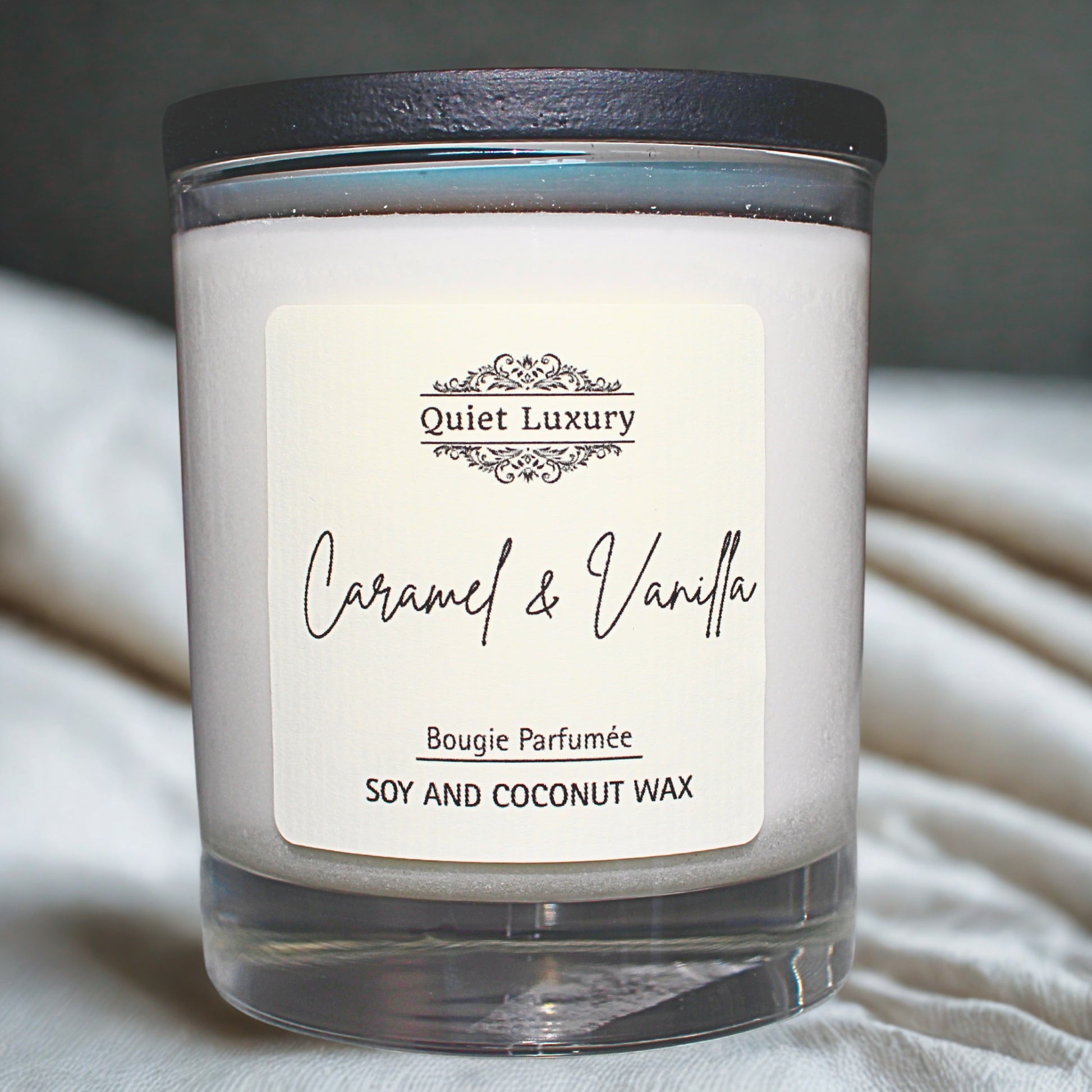 Caramel and vanilla Candle with 'Quiet Luxury' label on a neutral background