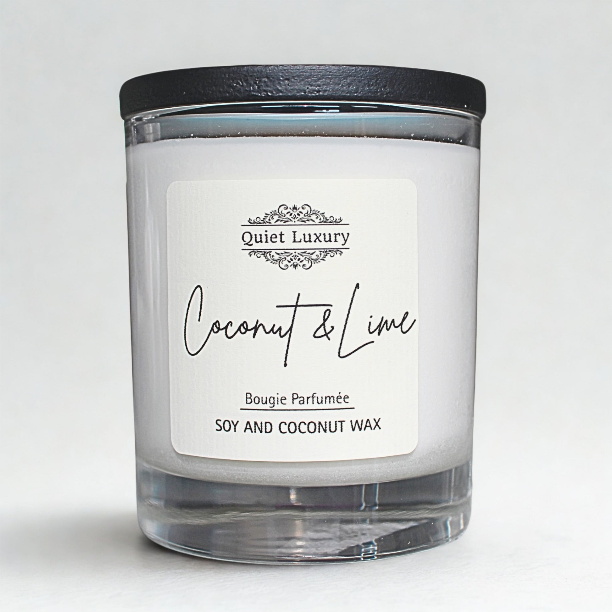 Coconut and lime soy Candle with a 'Quiet Luxury' label on a white background
