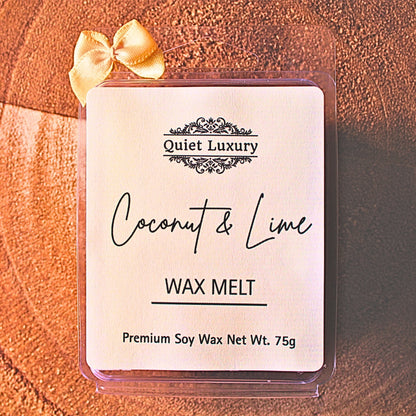 Coconut and lime scented soy wax melt in clear packaging with cream ribbon, wooden background.