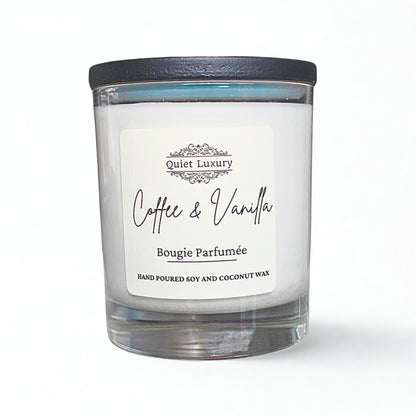 Coffee and vanilla scented soy and coconut wax candle in a clear glass jar with black lid