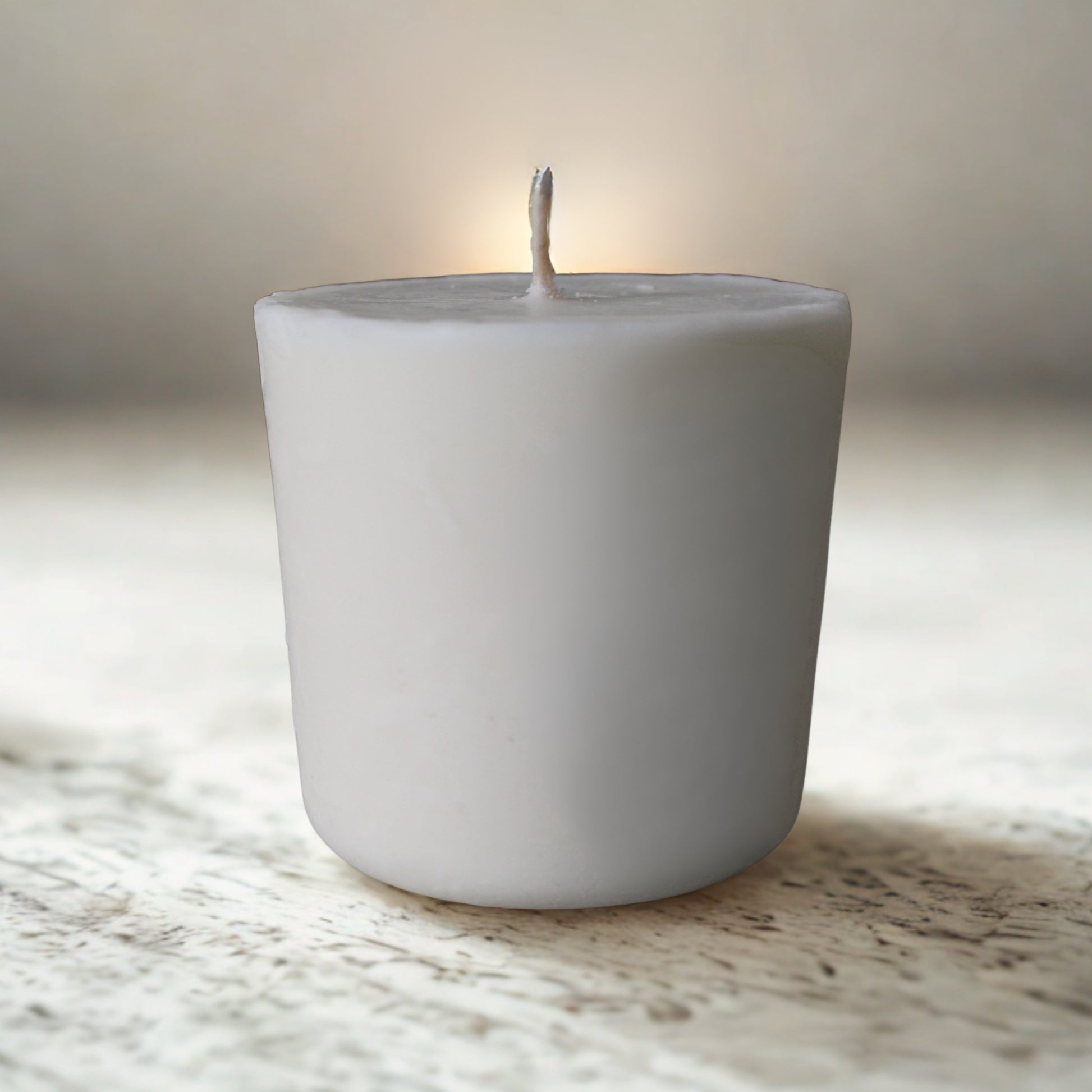 Eco soy candle refill on a marble surface with a blurred background