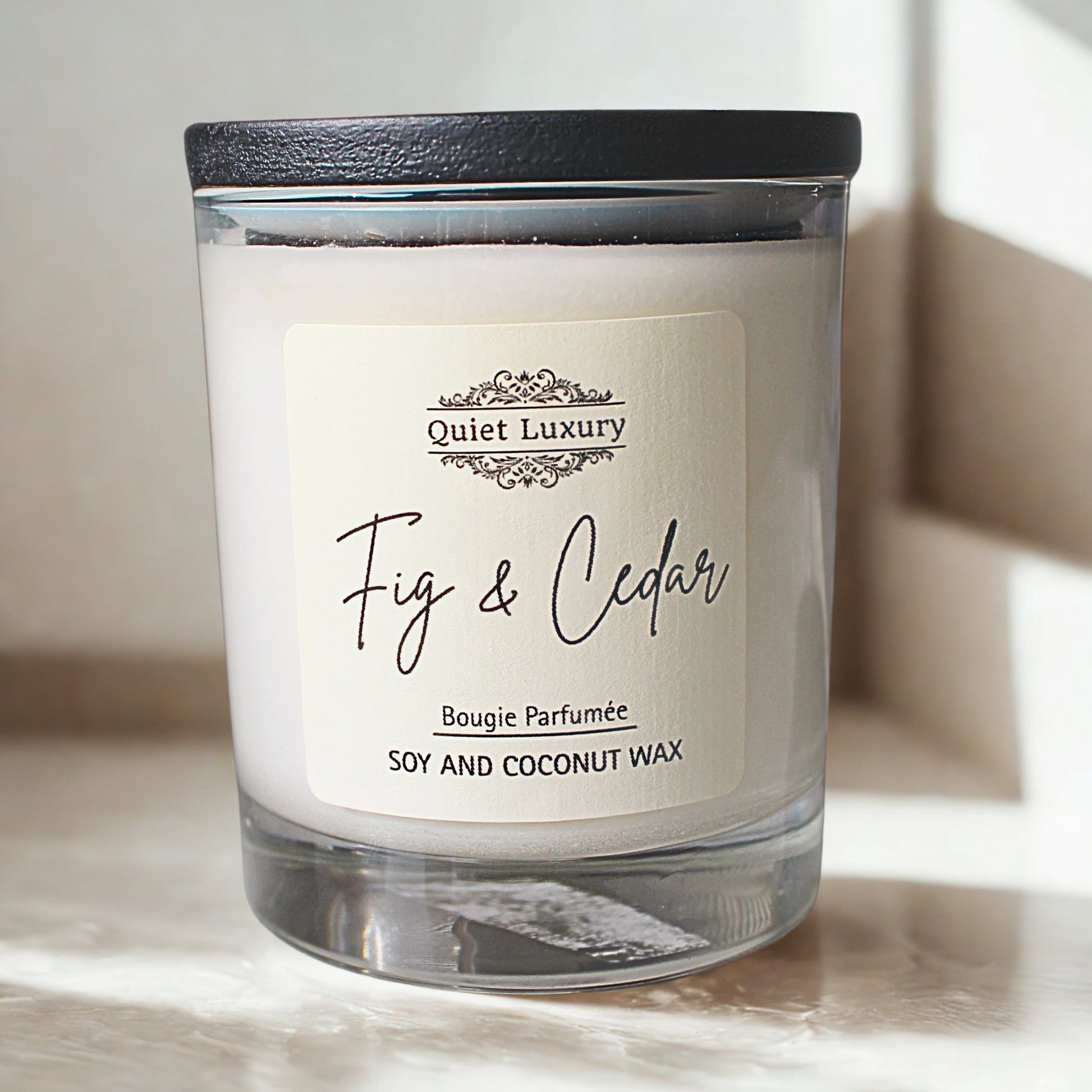 Fig and Cedar Soy and coconut wax Candle with 'Quiet Luxury' label on a light background