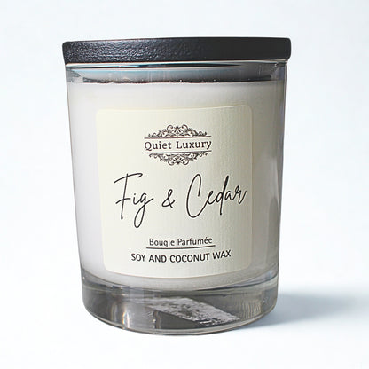 Fig and cedar luxury candle in a glass jar with black lid, soy and coconut wax