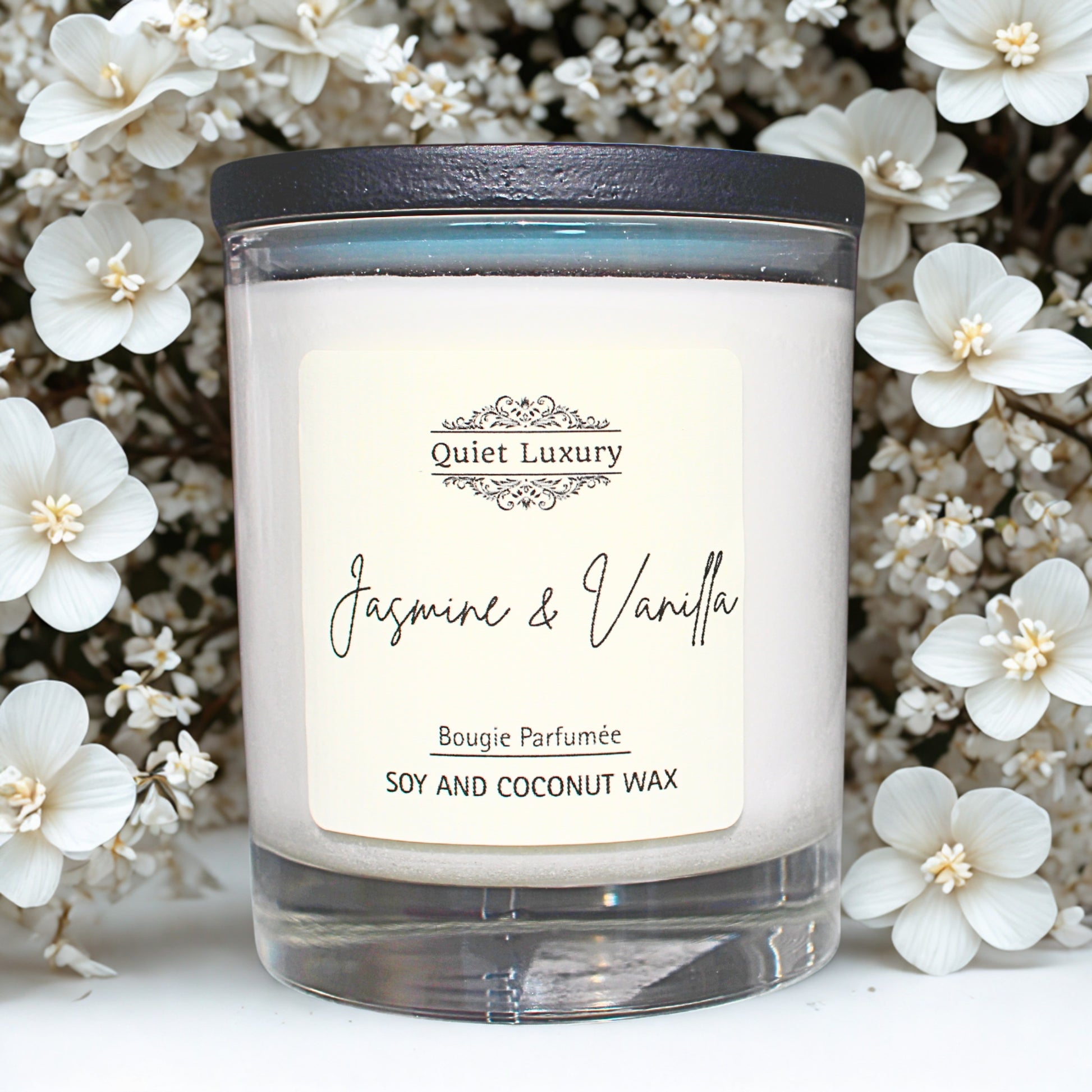 Candle labeled 'Jasmine & Vanilla' with a decorative label on a floral background