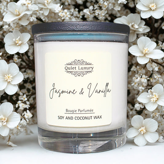 Candle labeled 'Jasmine & Vanilla' with a decorative label on a floral background