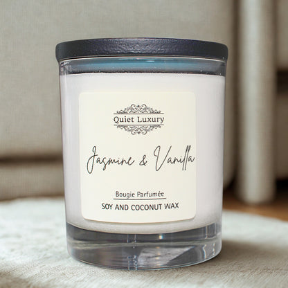 Jasmine and vanilla scented candle in glass jar, soy and coconut wax on fabric surface