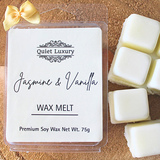 Packaged jasmine and vanilla wax melts with 'Quiet Luxury' branding and jasmine & vanilla scent on a wooden surface.