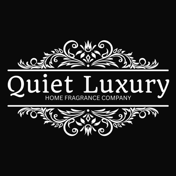 white logo with text displaying Quiet Luxury Home Fragrance Company on a plain black background