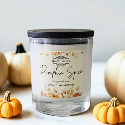 Candle labeled 'Pumpkin Spice' with pumpkins in the background